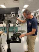 Dan Dalfonzo printing a face shield on a 3D printer