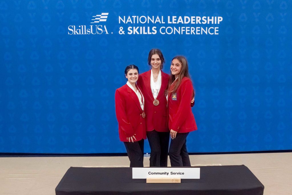 Backstage with their gold medals. From L-R, Mia Boscia, Kayla Tortorella and Abbey Regan. Photo by SkillsUSA.
