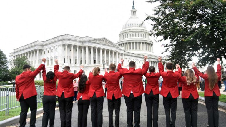 Photo of the SkillsUSA National officers walking toward the U.S. Capitol building.