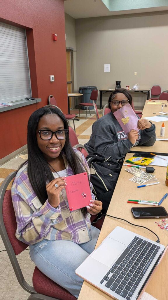 Photos of students making holiday cards.