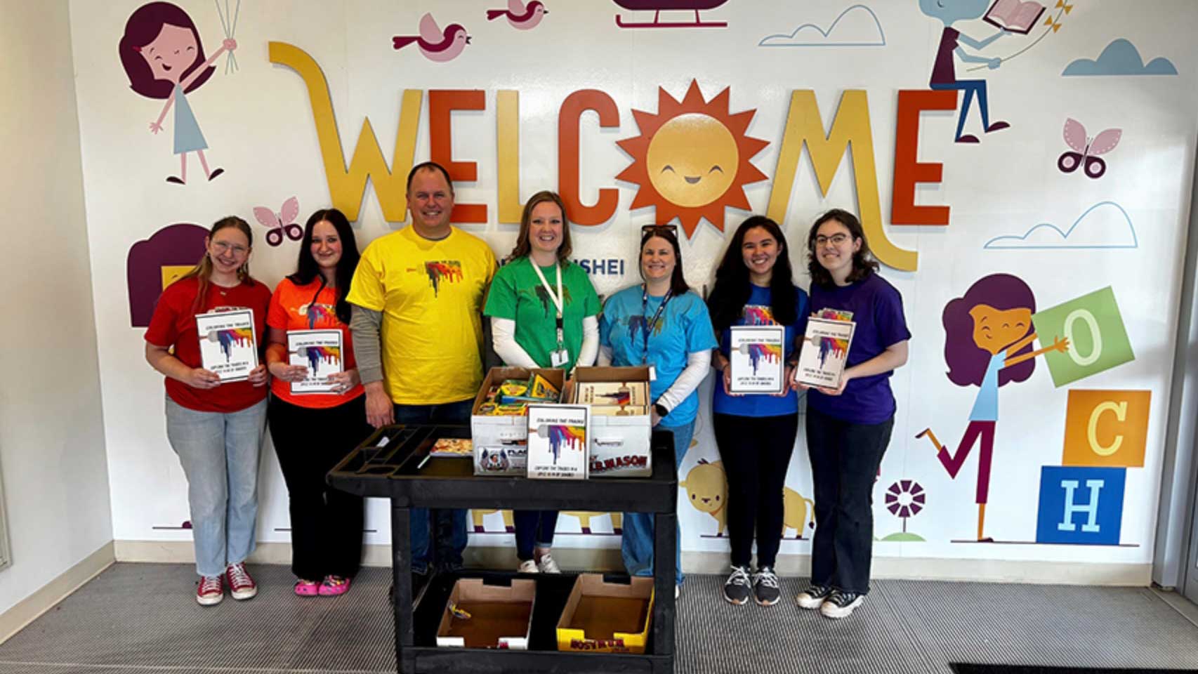 Niagara Career and Technical Education Center studnets and advisors pose with coloring books.