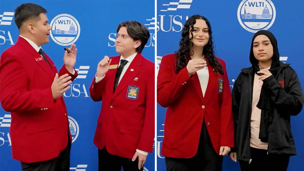 two students interviewing two other students