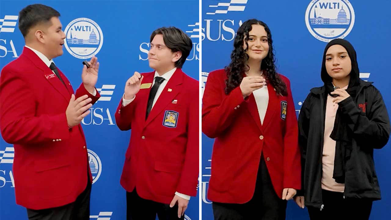 two students interviewing two other students