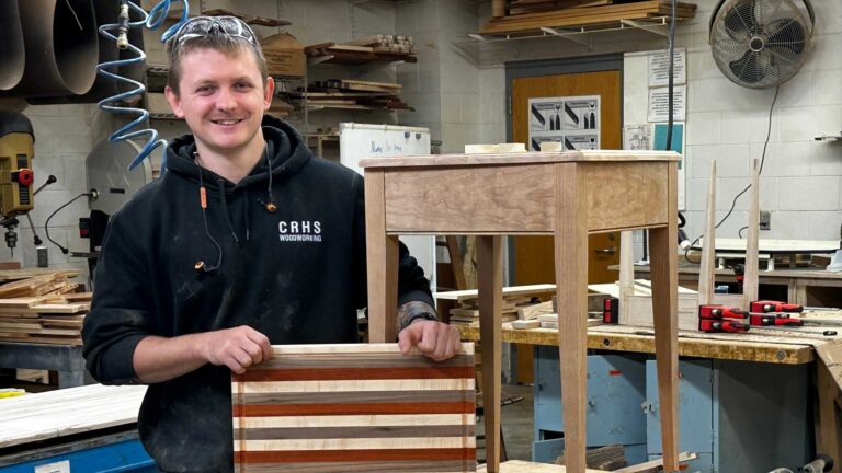 Avery Pipkin poses with a woodworking project.